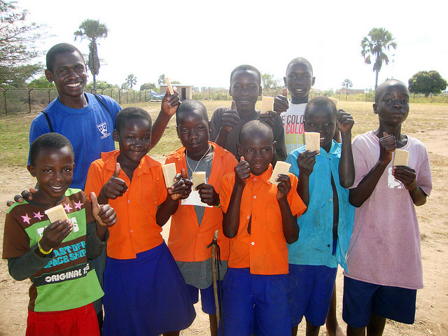 bright kids in Kabermaido, Uganda smiling at the camera